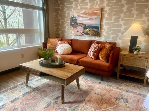 a living room with a couch and a coffee table at Quest Travels in Seattle