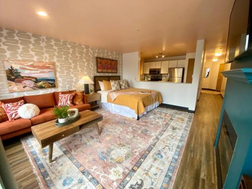 a bedroom with a bed and a living room at Quest Travels in Seattle