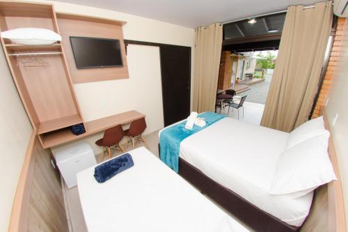 Katil atau katil-katil dalam bilik di Pousada Viva praia 30 metros da praia