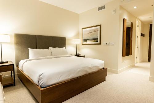 a bedroom with a large bed with a large headboard at Lift Park City Condominiums in Park City