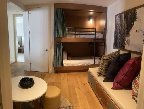 a living room with a couch and a bunk bed at Lift Park City Condominiums in Park City