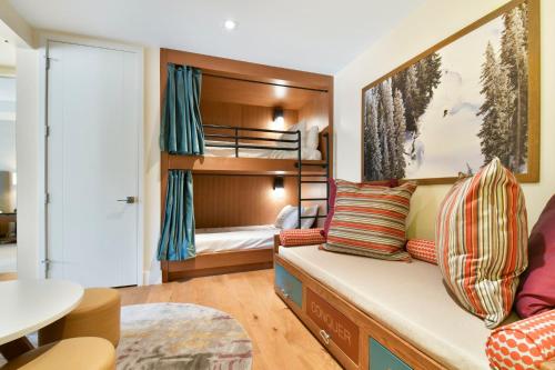 a living room with a couch and a bunk bed at Lift Park City Condominiums in Park City
