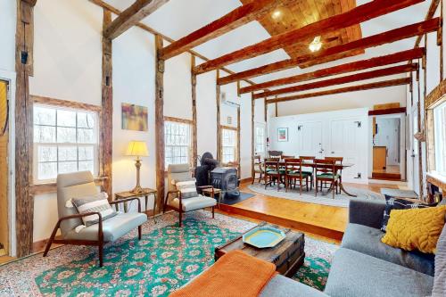 a living room with a couch and chairs and a table at Starry Plough in Bridgewater