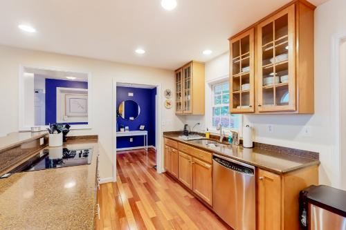 a kitchen with wooden cabinets and stainless steel appliances at Pleasants View in Bumpass