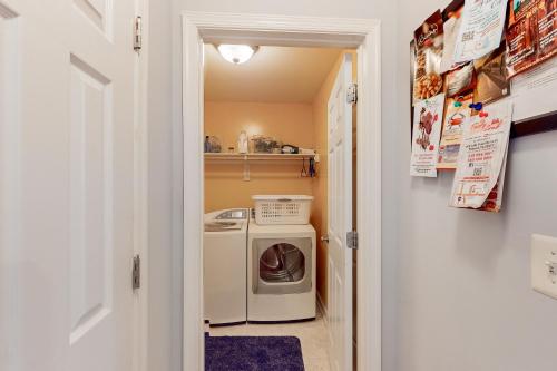 a small laundry room with a washer and dryer at Pleasants View in Bumpass