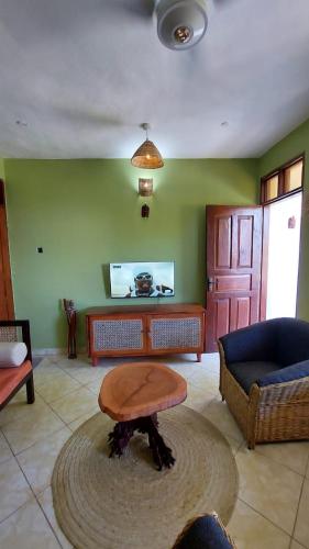 a living room with a table and a couch at The Costal Sunny Daze,076 8976 732 in Mombasa