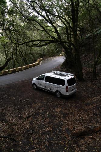 a white car parked on the side of a road at Macaronesia Campervan in Costa Del Silencio