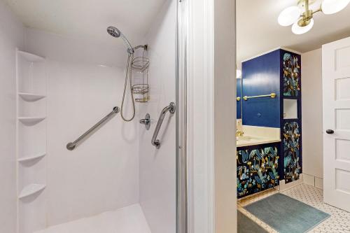 a bathroom with a shower and a sink at Multnomah Village Hideaway in Portland
