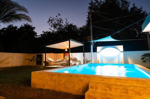 a large swimming pool in a backyard at night at New beach house @ Costa del Sol in La Paz