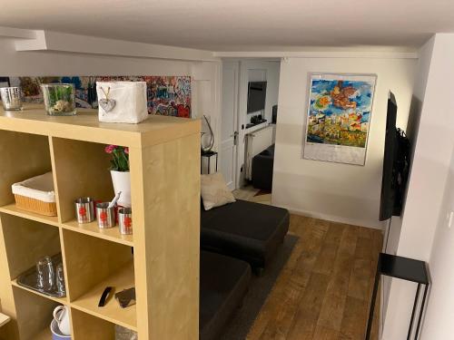 a small living room with a couch in a room at Xanten Basement Suite in Xanten