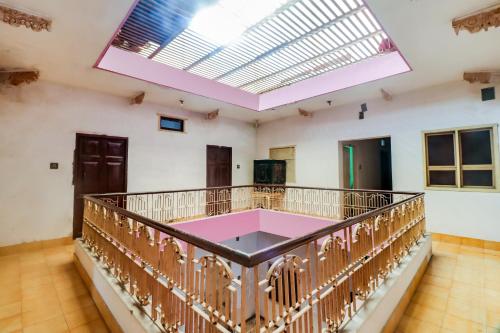 a large room with a balcony with a large skylight at SPOT ON Mishra Guest House in Varanasi