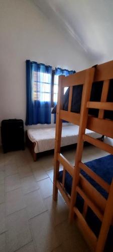 a bedroom with a bunk bed and a bed at La Lucila del Mar in Costa Azul