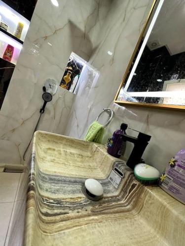 a bathroom counter with a sink and a mirror at Beautifull apartment F2 in Agadir