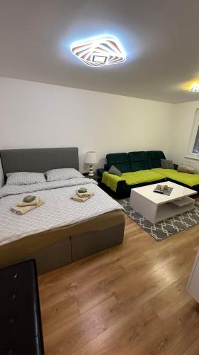 a living room with two beds and a couch at Apartman City Park Stráňany in Michalovce