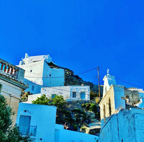 a group of white buildings on top of a hill at School House with Panoramic View in Serifos Chora