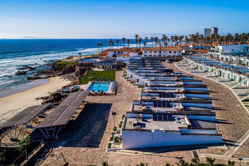 an aerial view of a beach with a row of hotels at Casa 12 - Playa Arcangel in Rosarito