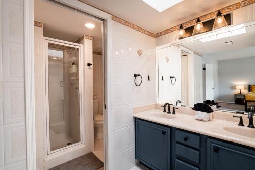 a bathroom with a sink and a shower at Scottsdale Old Town Haven, Walk To Old Town & Fashion Square Mall, Pool & Concierge Service! in Scottsdale