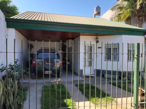 a house with a fence in front of it at BITTY in Chajarí