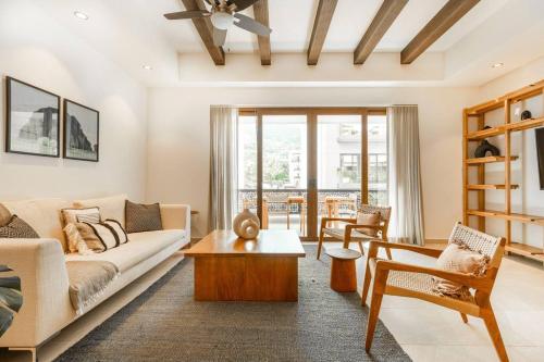 a living room with a couch and a table at Urban by Pardela in Puerto Vallarta