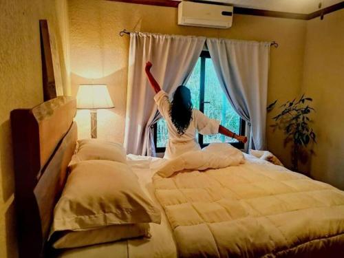 Ein Bett oder Betten in einem Zimmer der Unterkunft Vive Utila - Bed & Breakfast