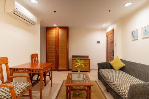 a living room with a couch and a table at Le Soleil de Boracay Hotel in Boracay