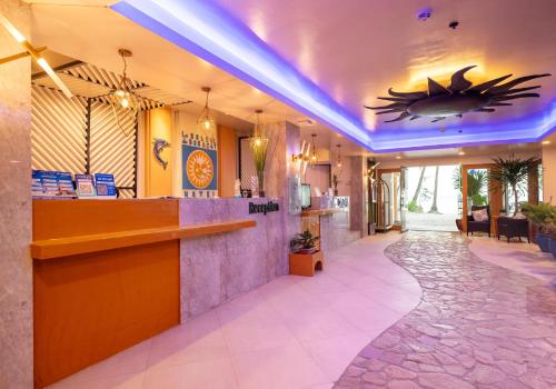 a lobby of a hotel with a shark on the ceiling at Le Soleil de Boracay Hotel in Boracay