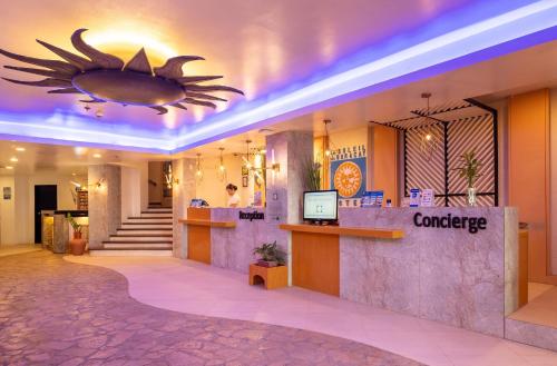 a lobby of a hotel with a counter at Le Soleil de Boracay Hotel in Boracay