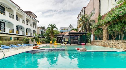 a swimming pool with blue water in a building at Le Soleil de Boracay Hotel in Boracay