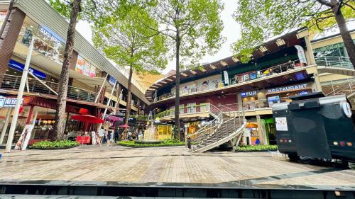 a mall with a staircase in the middle of a building at FRIENDS@SaiLom in Bangkok