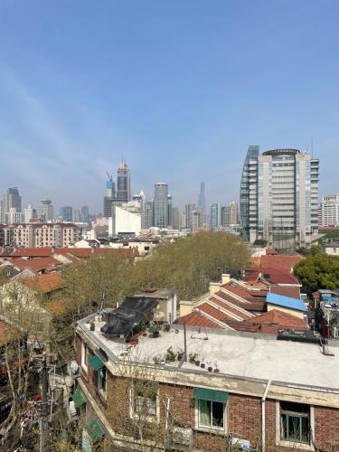 an overhead view of a city with tall buildings at 1930 French Minimalist Apartment in Shanghai