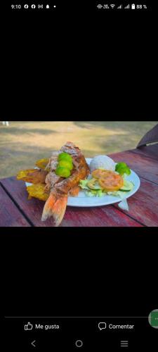a plate of food on top of a table at Hotel y Hostal Mi Reino Represa Prado Tolima in Prado