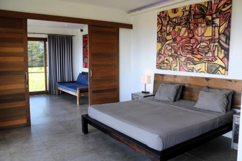 Кровать или кровати в номере Villa Awan Uluwatu
