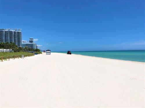 a white sandy beach with a view of the ocean at Ocean Front Units at Miami Beach in Miami Beach
