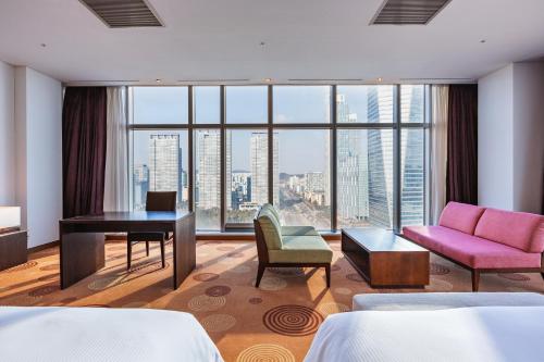 a hotel room with a view of the city at Orakai Songdo Park Hotel in Incheon