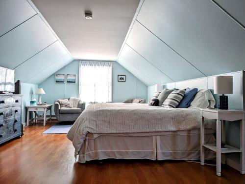 a bedroom with a large bed in a room at Beachy Watering Cove Cottage NEW in Prospect Harbor