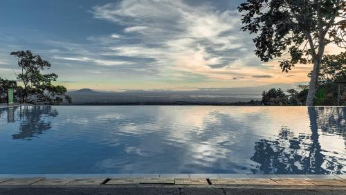 a swimming pool with a view of a mountain at Tanawin BnB in Orani