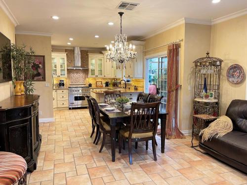 a kitchen and dining room with a table and chairs at CASA LUX MONICA Prime Santa Monica Luxury Home ONE-OF-A-KIND in Los Angeles