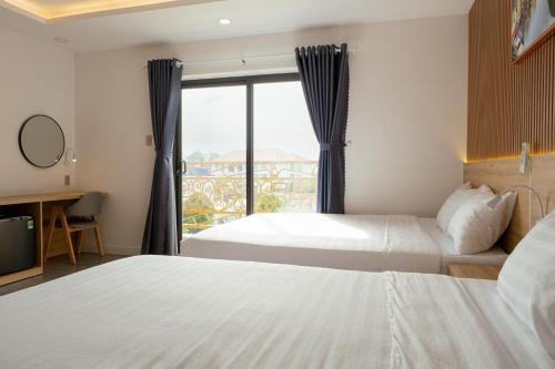 Cama o camas de una habitación en Ngọc Anh Hotel