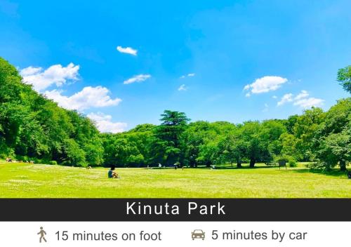 a picture of a park with a person sitting in a field at Tokyu Stay Yoga in Tokyo