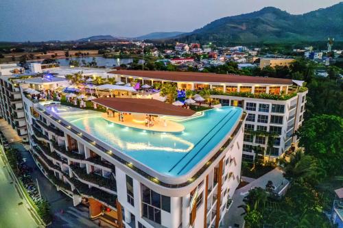 an overhead view of a building with a swimming pool at HOMA Cherngtalay Phuket in Bang Tao Beach