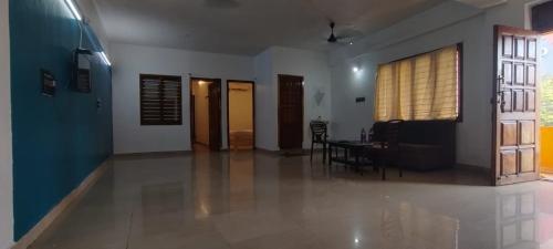 a living room with a table and a dining room at cg residency in Puducherry