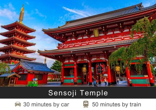 a large red building with a large tower at Tokyu Stay Nishi Shinjuku in Tokyo