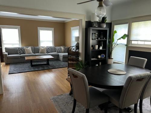 a living room with a table and a couch at Beautiful Luxury Suite B of Shorewood Home in Shorewood