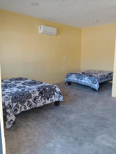 Llit o llits en una habitació de Habitaciones en san Blas, Aloha Beach Club