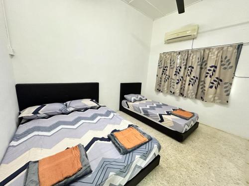 Katil atau katil-katil dalam bilik di Kampunghomestay Kuantan