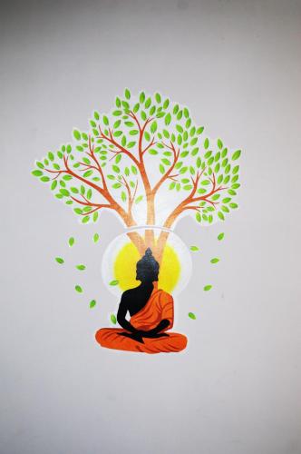 a painting of a woman sitting under a tree at Manali Outdoor Retreat by Sheosante in Manāli