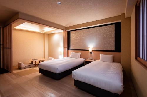เตียงในห้องที่ Rinn Kiyomizu Gion