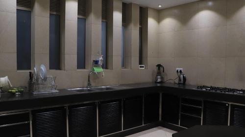a kitchen with a sink and a counter top at Dunest Villa in Bentota