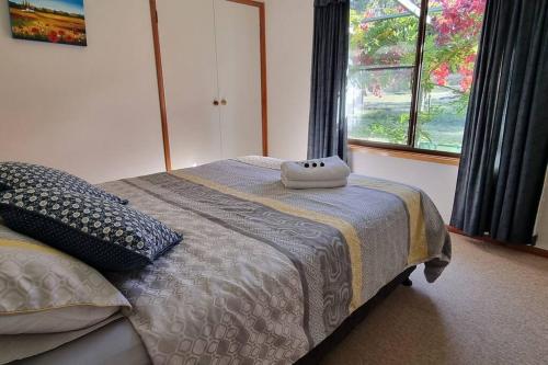 a bedroom with a bed with a pillow on it at Burramere Estate in Eukey