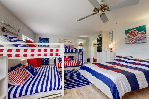 a bedroom with two bunk beds with american flags at The Blue Laker in Kingsland
